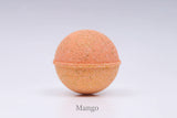 Peach-colored bath bomb on a light background